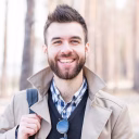 portrait-smiling-young-man-looking-camera_23-2148148708